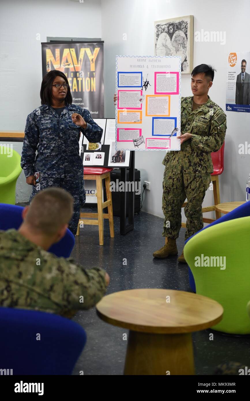 SINGAPORE - Sailors describe some Native American inventions still used widely today during a Native American Heritage Month celebration at the Singapore Area Coordinator’s (SAC) Café Lah Community Center Nov. 16, 2017. U.S. military service members highlighted the achievements and contributions of Native Americans and Alaskans to both the United States and the American military experience. Stock Photo