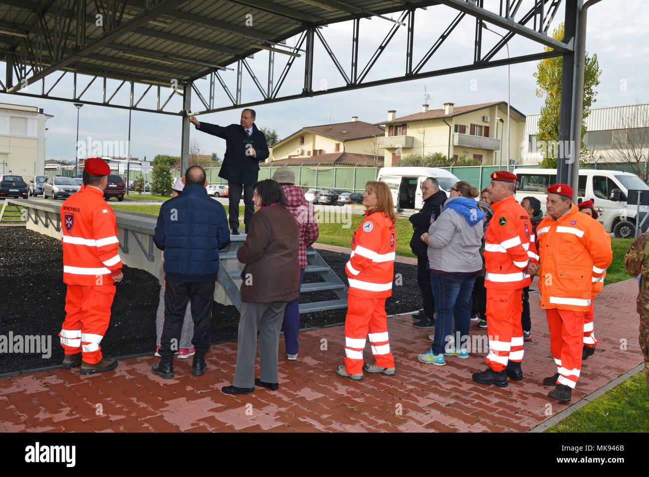 Ivano Trevisanutto, chief, Training Support Center Italy, shows the training facility area to a delegation from “Associazione Il Nuovo Ponte” and Sovereign Military Order, during a visit to Caserma Ederle Nov. 28, 2017. Associazione Il Nuovo Ponte is a social solidarity cooperative that since 1984 runs Social-Health Services for people with disabilities. (U.S. Army photo by Paolo Bovo) Stock Photo