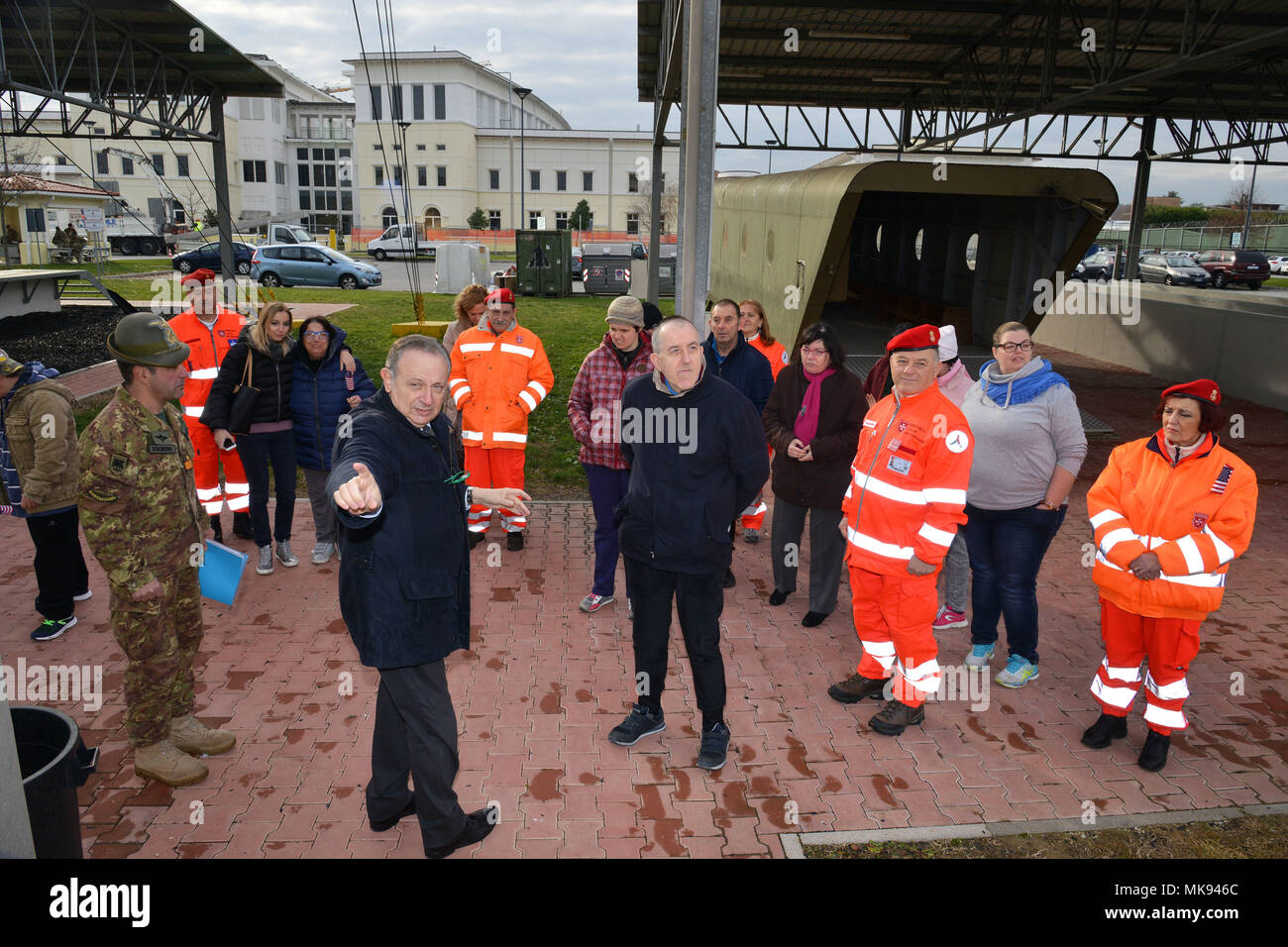Ivano Trevisanutto, chief, Training Support Center Italy, shows the training facility area to a delegation from “Associazione Il Nuovo Ponte” and Sovereign Military Order, during a visit to Caserma Ederle Nov. 28, 2017. Associazione Il Nuovo Ponte is a social solidarity cooperative that since 1984 runs Social-Health Services for people with disabilities. (U.S. Army photo by Paolo Bovo) Stock Photo