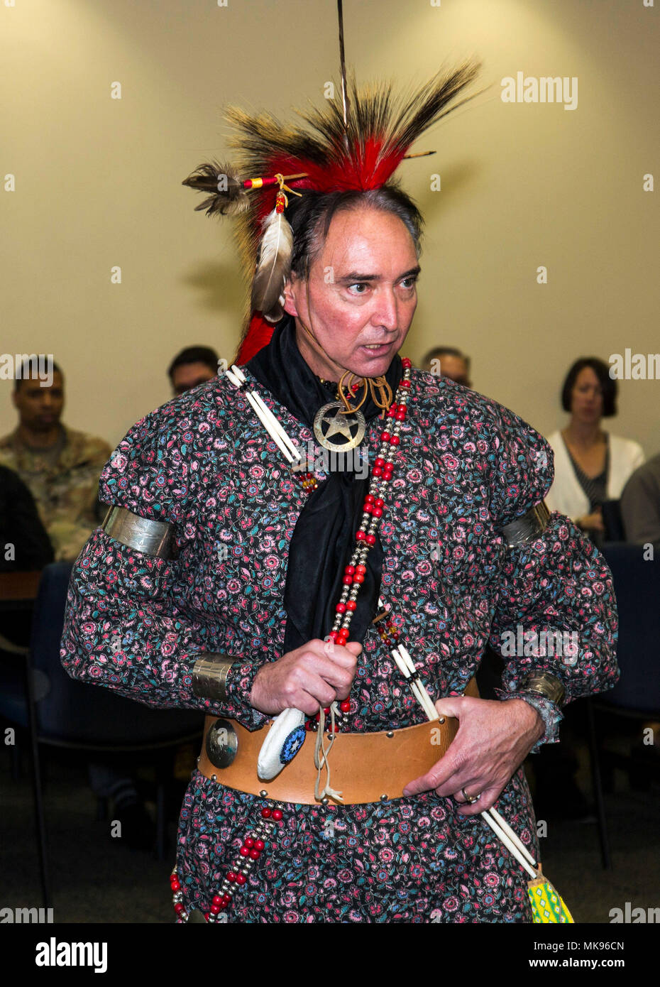 MacDill AFB, Fla. – (Nov. 29, 2017) Retired U.S. Navy Master Chief and USCENTCOM civilian employee, Timothy Vickers discusses Kiowa culture during a presentation at U.S. Central Command headquarters. Vickers’ Kiowa tribal heritage stems from the line of Chief Satanta (White Bear), one of the best known, and last, of the Kiowa war chiefs. USCENTCOM celebrates National American Indian Heritage Month every November to recognize the contributions made by American Indian and Alaska Native people. Stock Photo