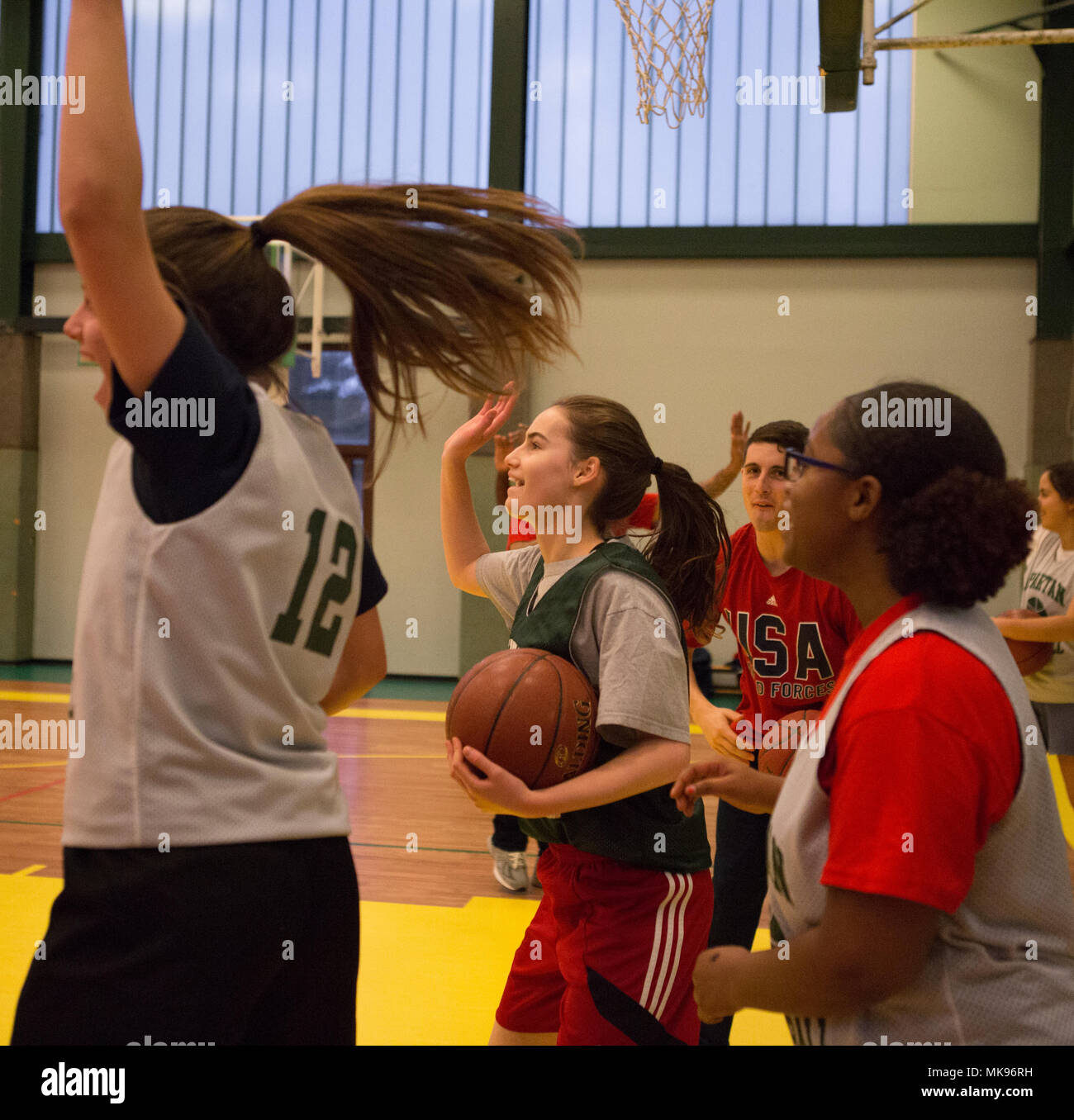 20171130-N-EJ549-0115 SHAPE, Belgium (Nov. 30, 2017) Members of the Supreme  Headquarters Allied Powers Europe (SHAPE) American High School Girls  Basketball Team celebrate making a series of baskets at the SHAPE American  High