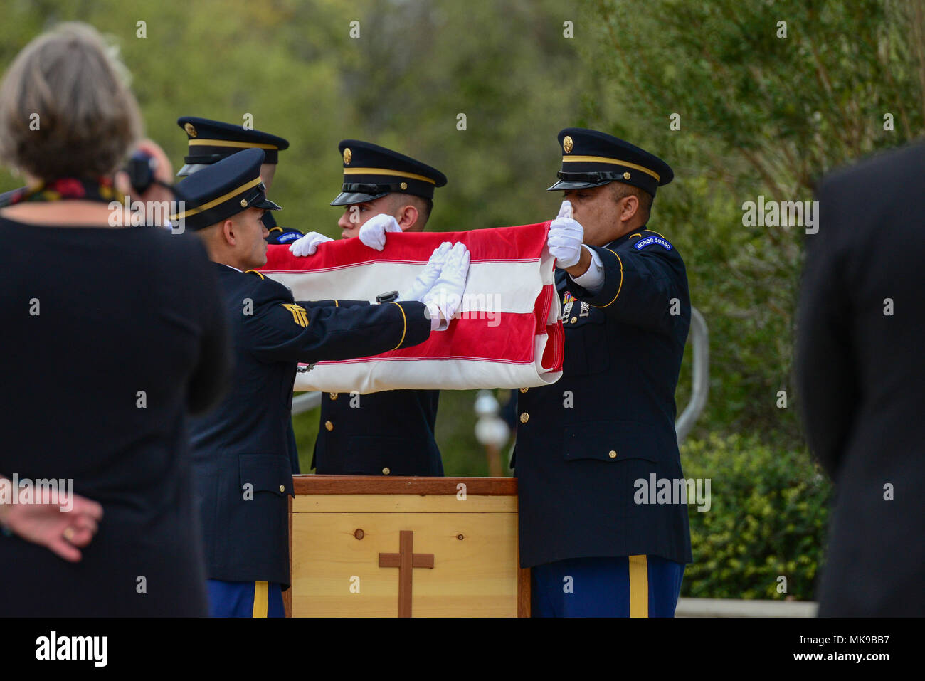 Retired Gen. Richard E. Cavazos, the U.S. Army's first Hispanic four-star general, caskets' U.S. Flag is removed and folded by the honorary pallbearers during his internment ceremony Nov. 14, 2017, at JBSA-Fort Sam Houston National Cemetery, San Antonio, Texas. In 1976 Mexican-American Cavazos made military history by becoming the first Hispanic to attain the rank of brigadier general in the United States Army. Less than 20 years later, the native Texan would again make history by being appointed the Army's first Hispanic four-star general. He had been retired since 1984 and died Oct. 29 after Stock Photo