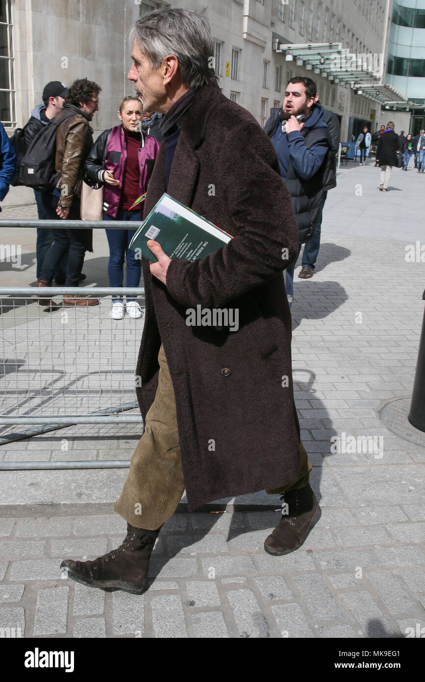 Jeremy Irons leaving BBC Studios with a large book of poems in London