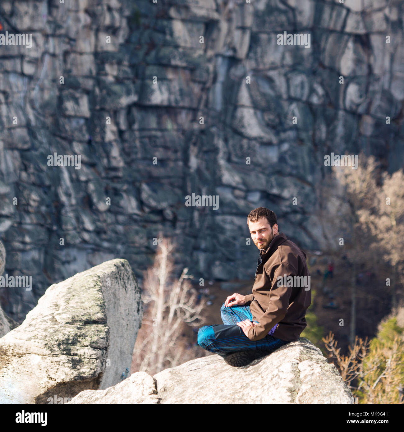 Man sitting on top mountain hi-res stock photography and images - Alamy