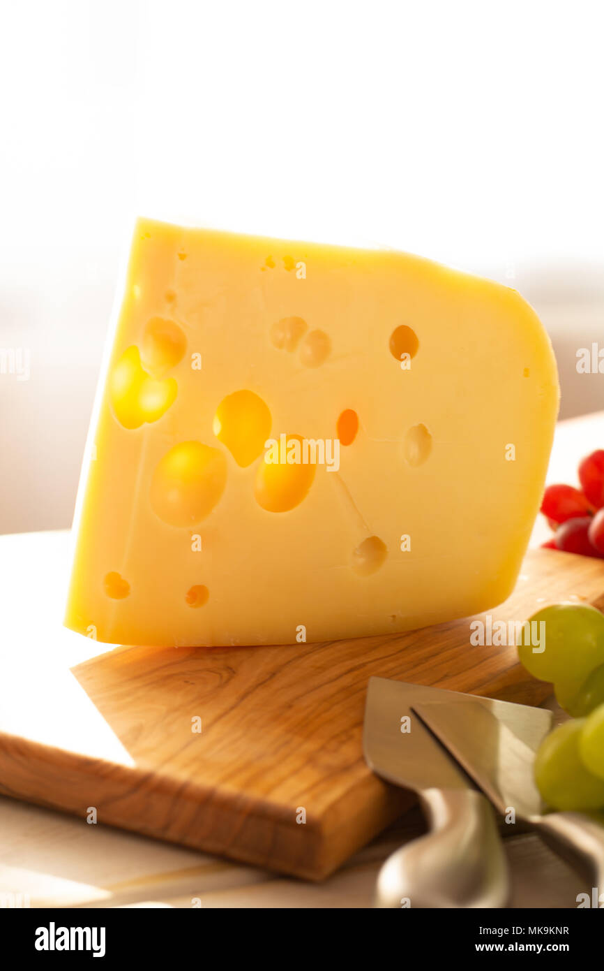 Dutch hard cheese Maasdam or Emmentaler, cheese with holes Stock Photo