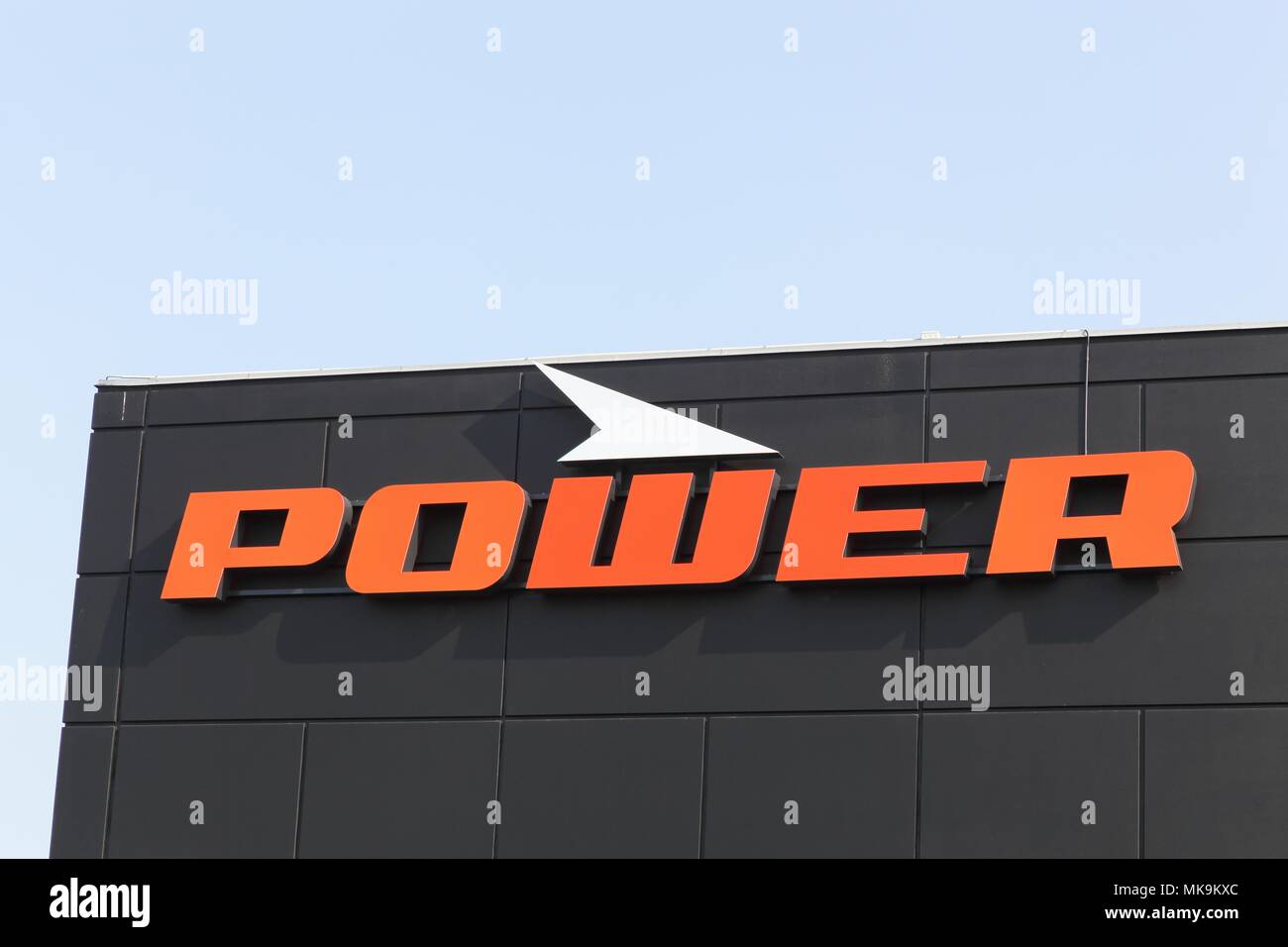 Tilst, Denmark - April 20, 2018: Power logo on a wall. Power is a retail chain in consumer electronics and white goods in Denmark Stock Photo