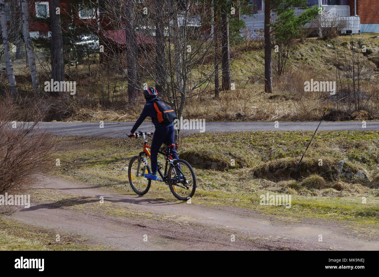 Child riding his bicycle to shool Stock Photo