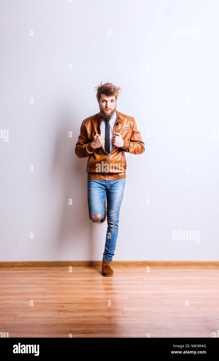 Portrait of a young hipster man in a studio. Copy space Stock Photo - Alamy