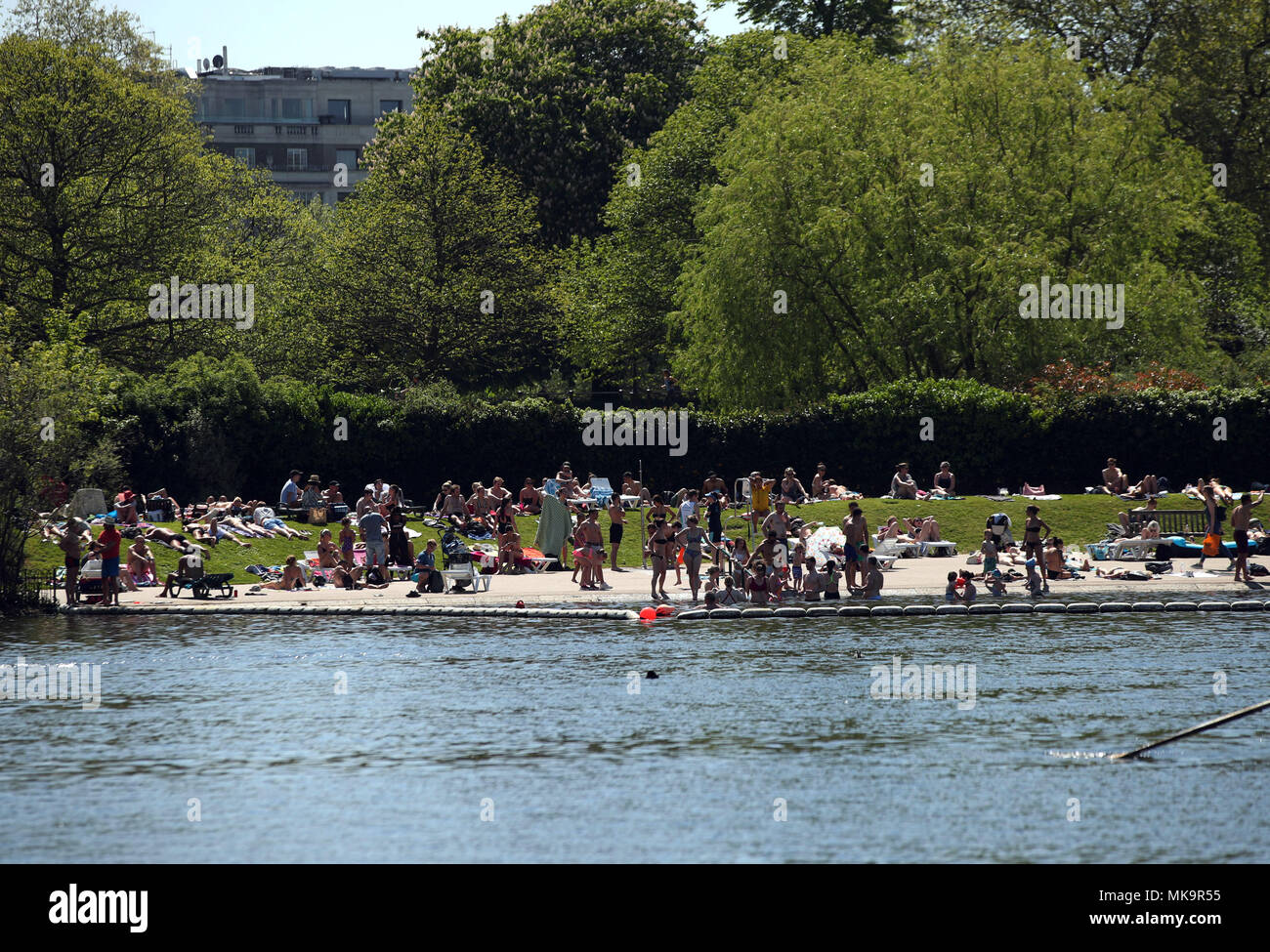 People enjoying the hot weather in Hyde Park, London, as the Bank