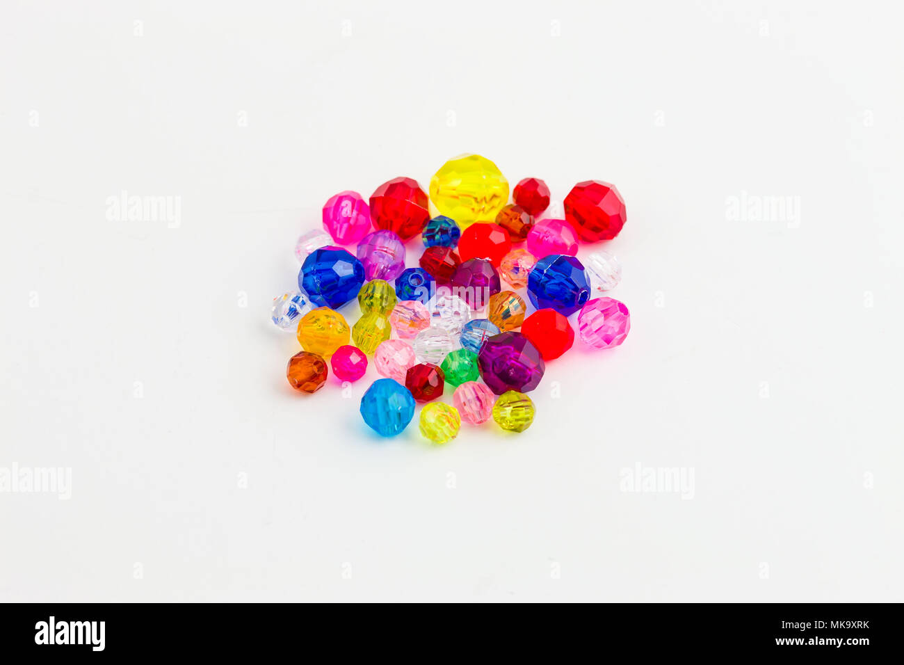 several multi colored beads of varying sizes used to create jewelry Stock Photo