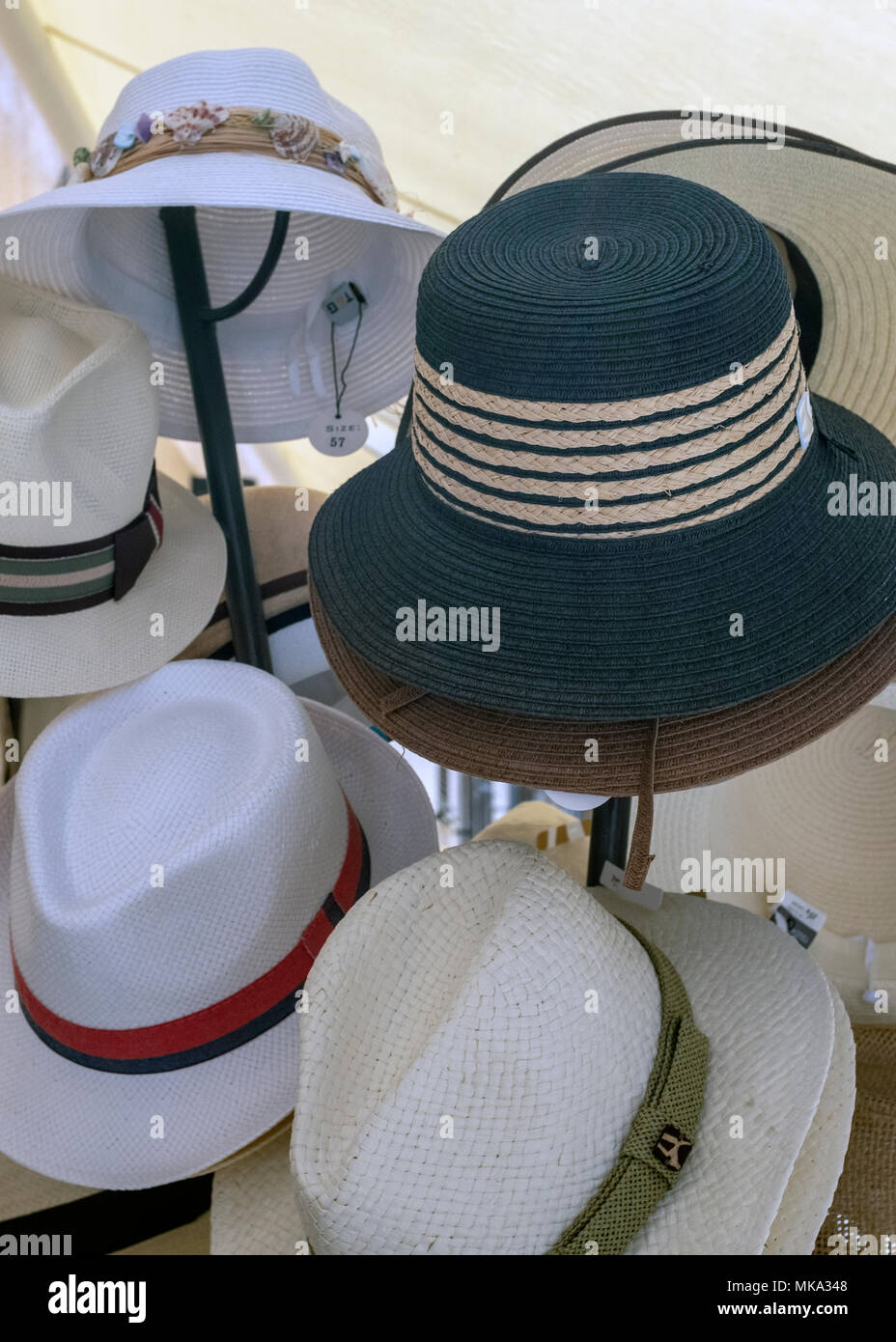 Summer hats on display in Pollensa, Mallorca, Spain. Stock Photo