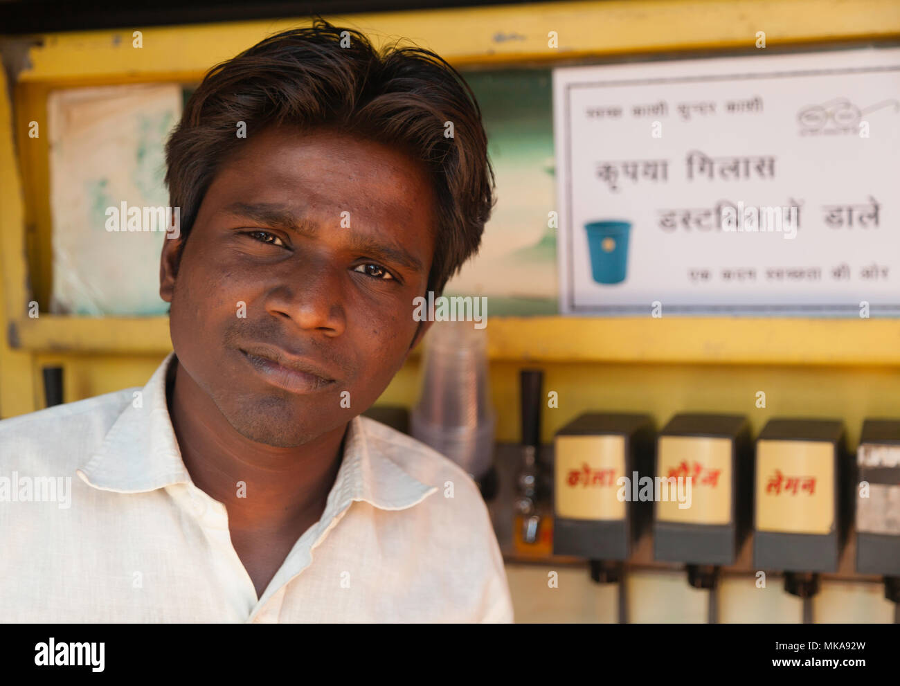 After purchasing a soft drink to quench my thirst in the midday heat of Varanasi this chatty gentleman insisted that I take his photograph. Stock Photo