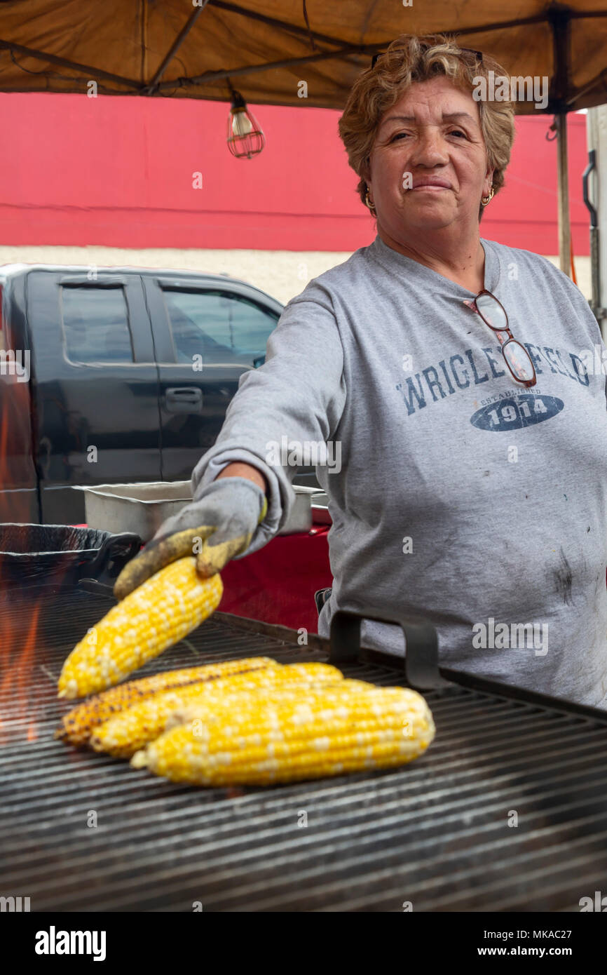 Detroit, Michigan USA - 6 May 2018 - A woman grills corn during Detroit's Cinco de Mayo celebration. Credit: Jim West/Alamy Live News Stock Photo