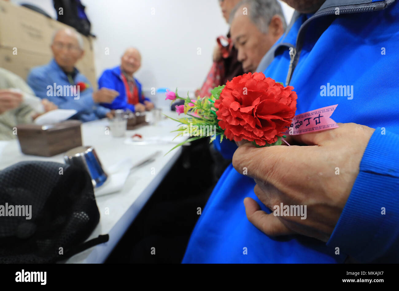 08th May, 2018. Parents' Day A carnation is pinned on the chest of a senior citizen in Seoul on