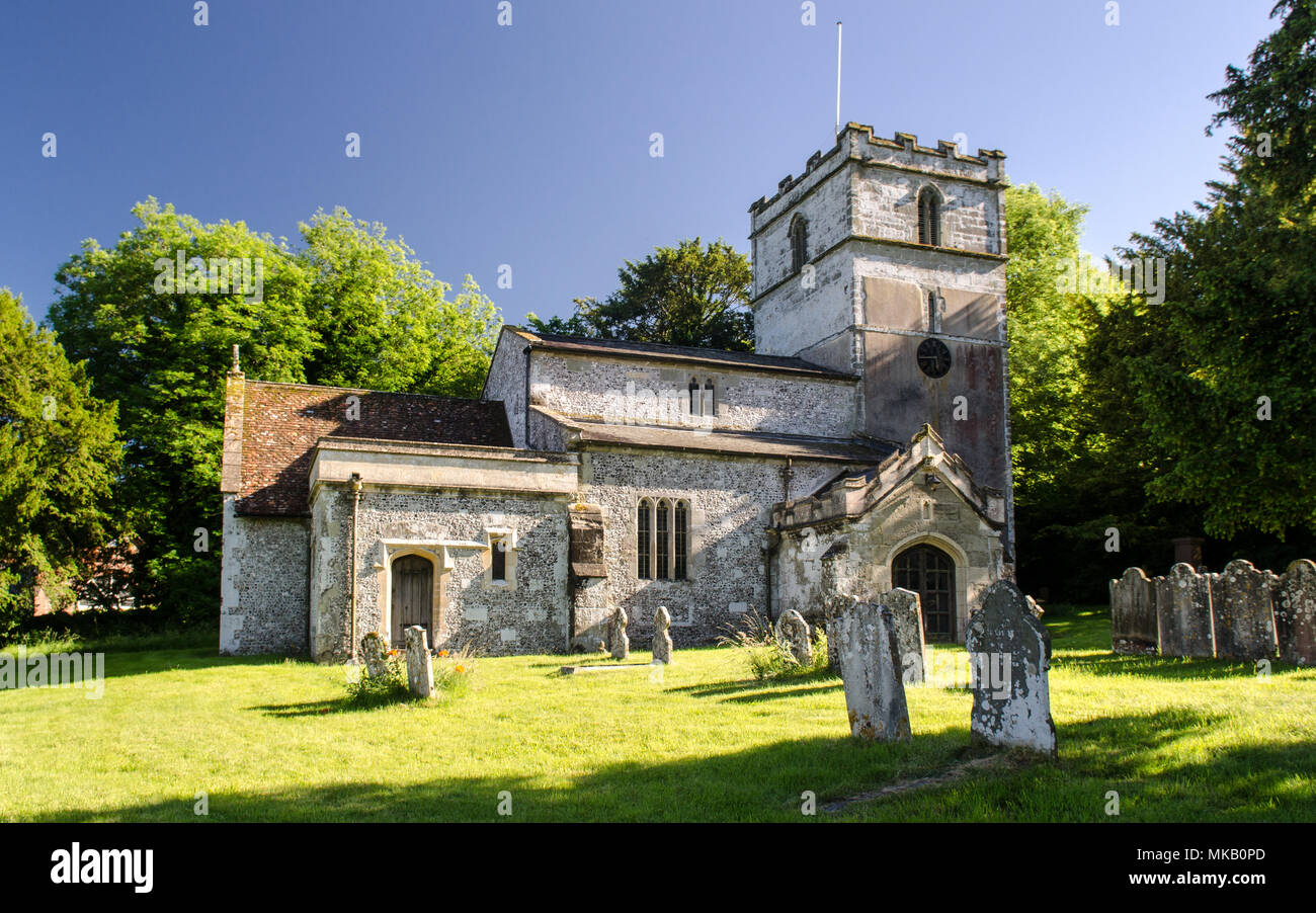Wimborne, England, UK - June 29, 2013: Summer sun shines on the traditional parish church of Gussage St Michael in Dorset's Cranborne Chase. Stock Photo