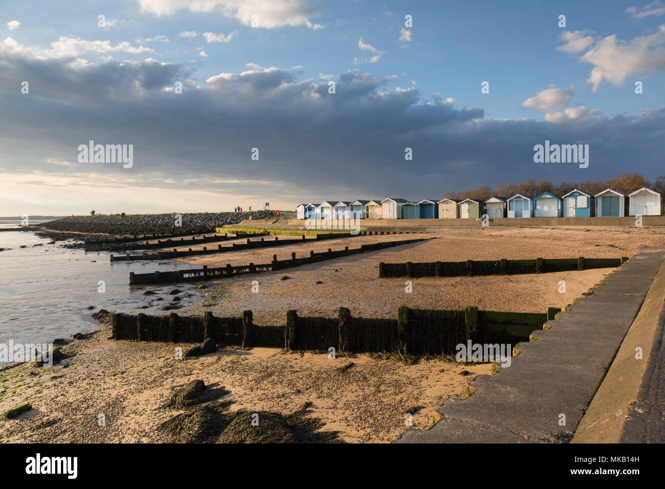 Bright light over the beach huts at Brightlingsea, Essex, UK. Stock Photo