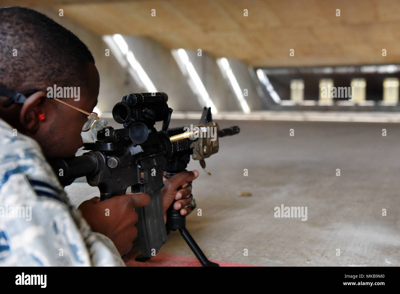 U.S. Air Force Airman 1st Class Naigo Chambers, 39th Security Forces  Squadron member, fires an M4 carbine rifle during the Combat Arms training  and Maintenance Qualifications course Nov. 16, 2017, at Incirlik