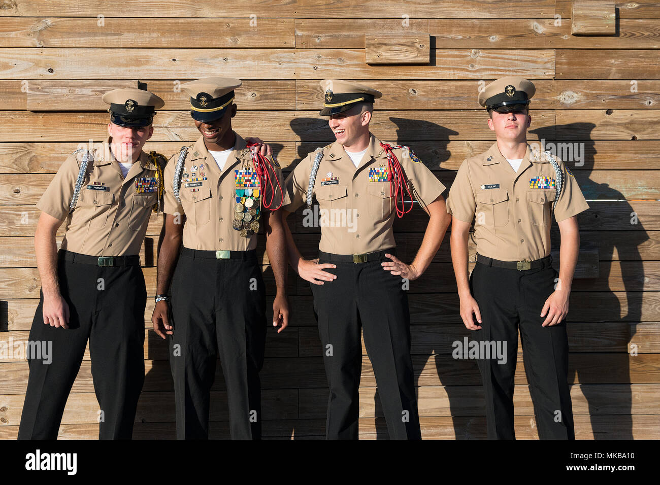 171104-N-PJ969-0120 FORT PIERCE, Fla., (Nov. 4, 2017) Navy Junior Reserve Officers Training Corps Cadets Micheal Parnass, Dave Robinson, Jordan Verderber and Matthew Ciolino from the St. Lucie West Centennial High ceremonial guard, prepare to parade the colors before a U.S. Navy public demonstration. (U.S. Navy photo by Petty Officer 1st Class Abe McNatt) Stock Photo