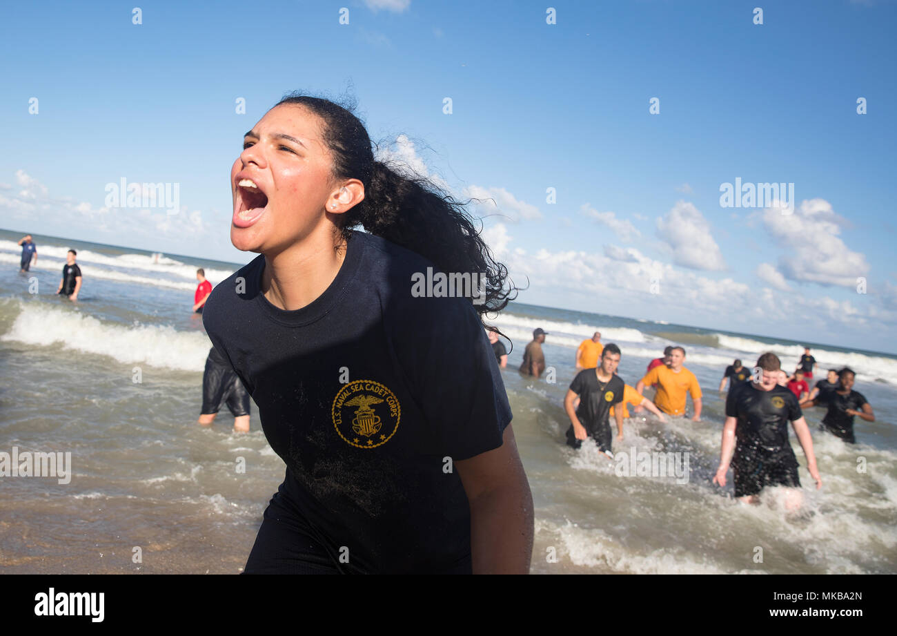 171104-N-PJ969-1169 FORT PIERCE, Fla., (Nov. 4, 2017) U.S. Naval Sea Cadet Corps Petty Officer 1st Class Morales, Centurion Battalion, provides a rallying cry to her cadets during SEAL inspired beach physical training. (U.S. Navy photo by Petty Officer 1st Class Abe McNatt) Stock Photo