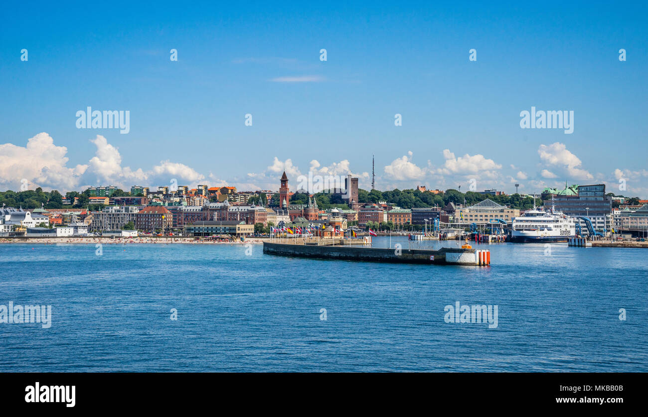 the Baltic Sea coastal city of Helsingborg with view of the harbour wall, the Tropical Beach and the prominent towers of the Helsingborg City Hall and Stock Photo
