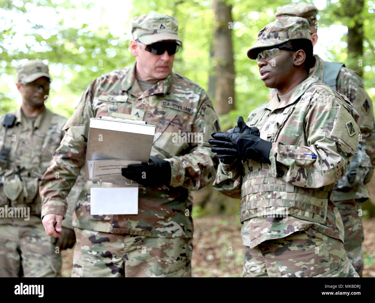 Chemical Corps Command Sgt. Maj. Henney Hodgkins (right) discusses her