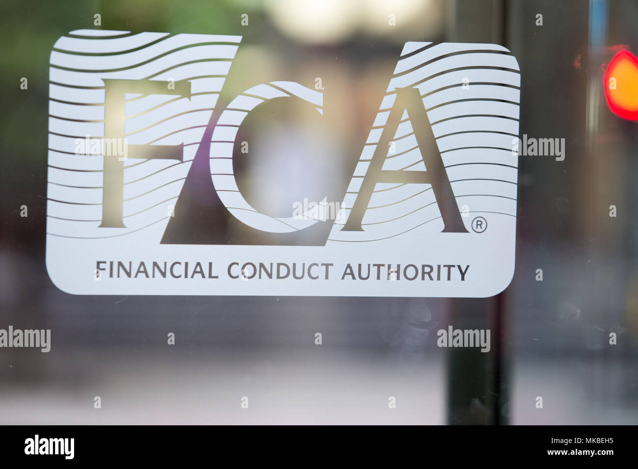 Financial Conduct Authority (FCA) offices, North Colonnade, Docklands, London. Picture shows corporate logo on the glass entrance Stock Photo