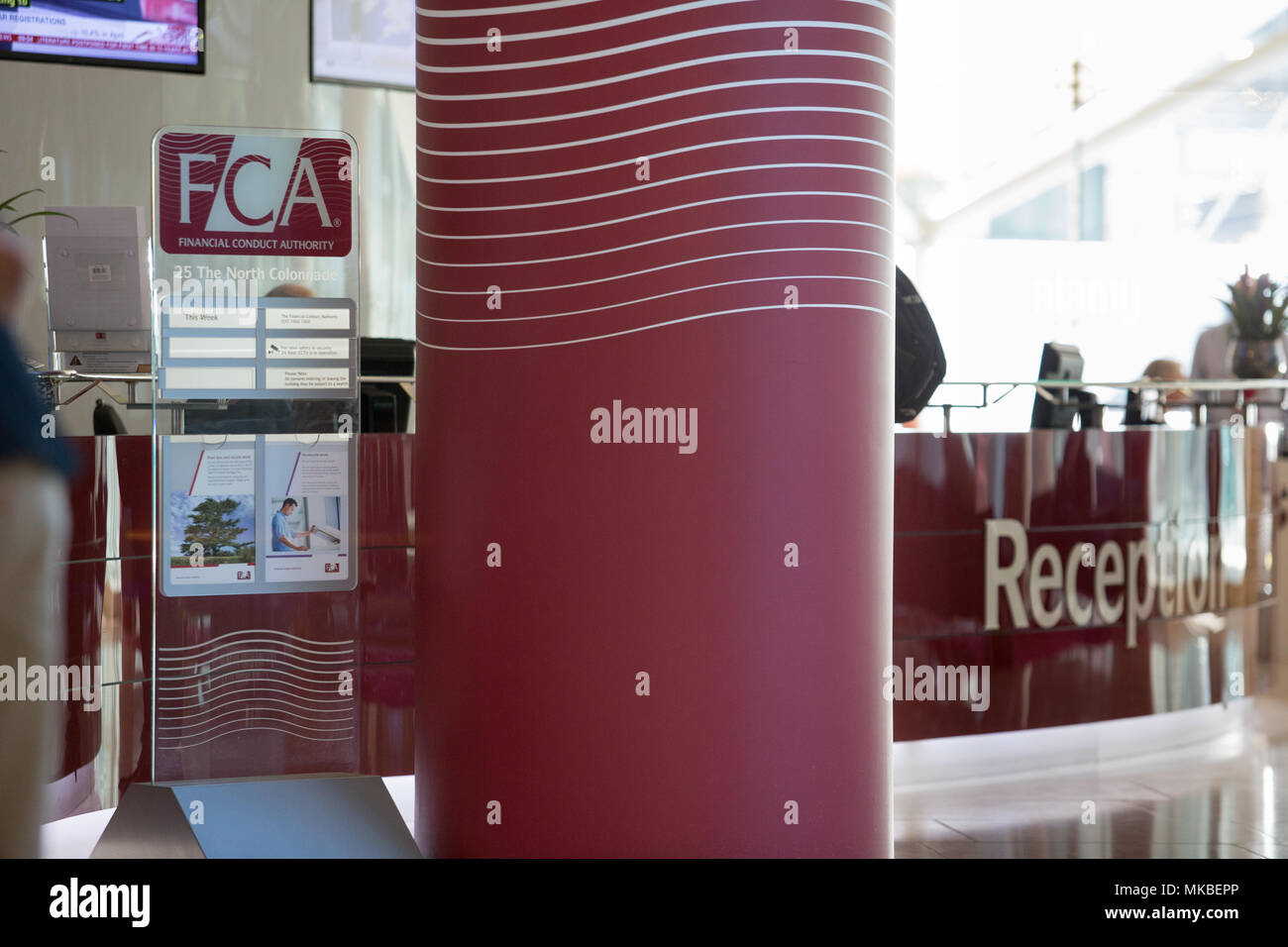 Financial Conduct Authority (FCA) offices, North Colonnade, Docklands, London. Reception showing corporate logo Stock Photo