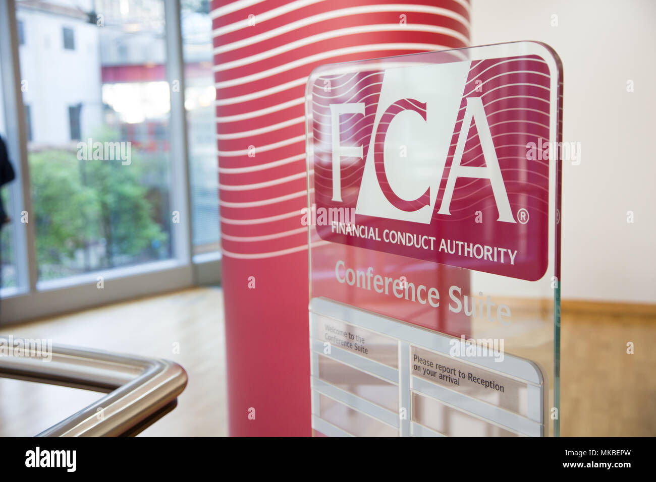 Financial Conduct Authority (FCA) offices, North Colonnade, Docklands, London. Upstairs reception showing corporate logo Stock Photo