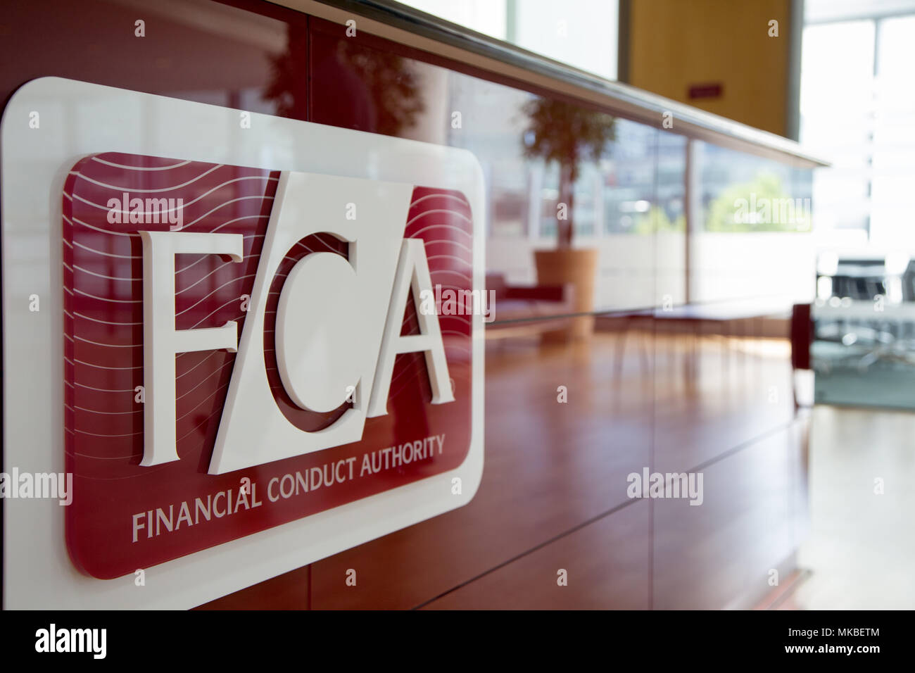 Financial Conduct Authority (FCA) offices, North Colonnade, Docklands, London. Upstairs reception showing corporate logo Stock Photo