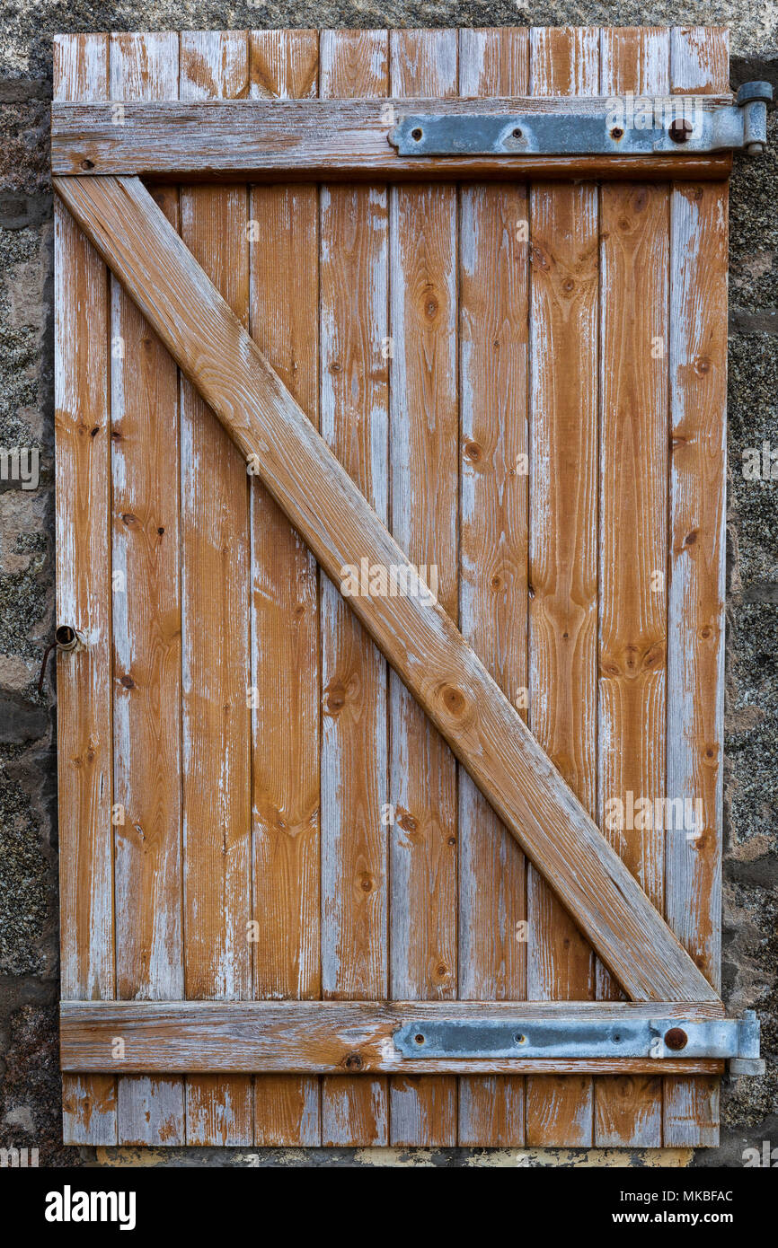 Fading wooden window shutter on a cottage in the fishing village of Crovie, Aberdeenshire, Scotland,UK Stock Photo