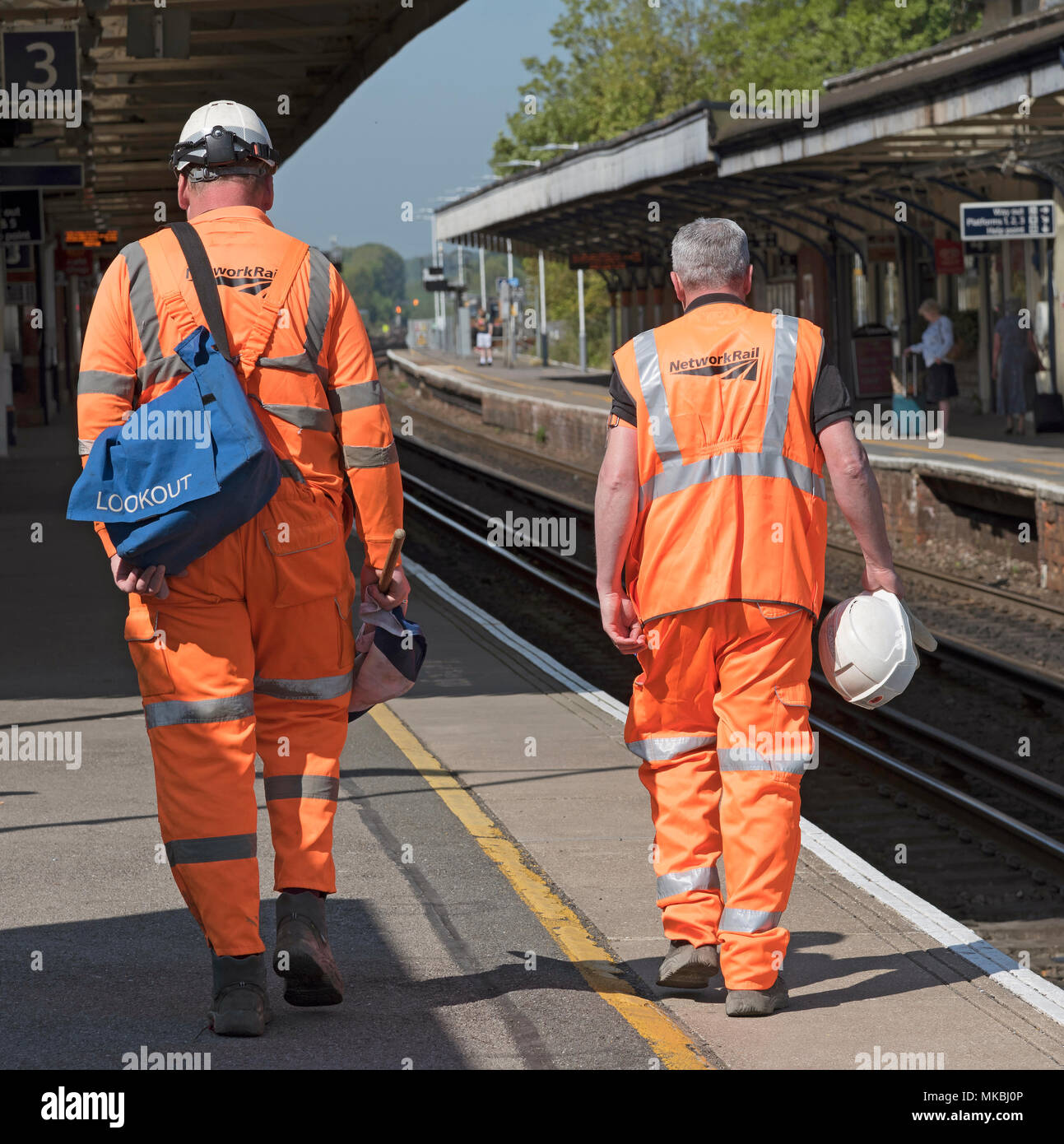 Permanent Way engineers dressed in reflective clothing at Basingstoke Station, Hampshire, England UK. 2018. Stock Photo