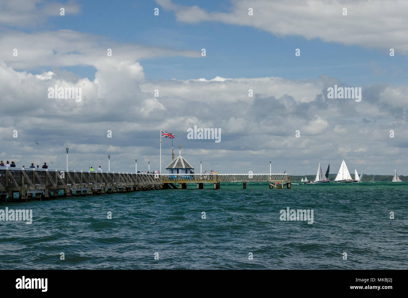 The 2017 Rolex Fastnet Yacht Race passing Yarmouth Pier, on the Isle of Wight on the 6th August 2017. Stock Photo