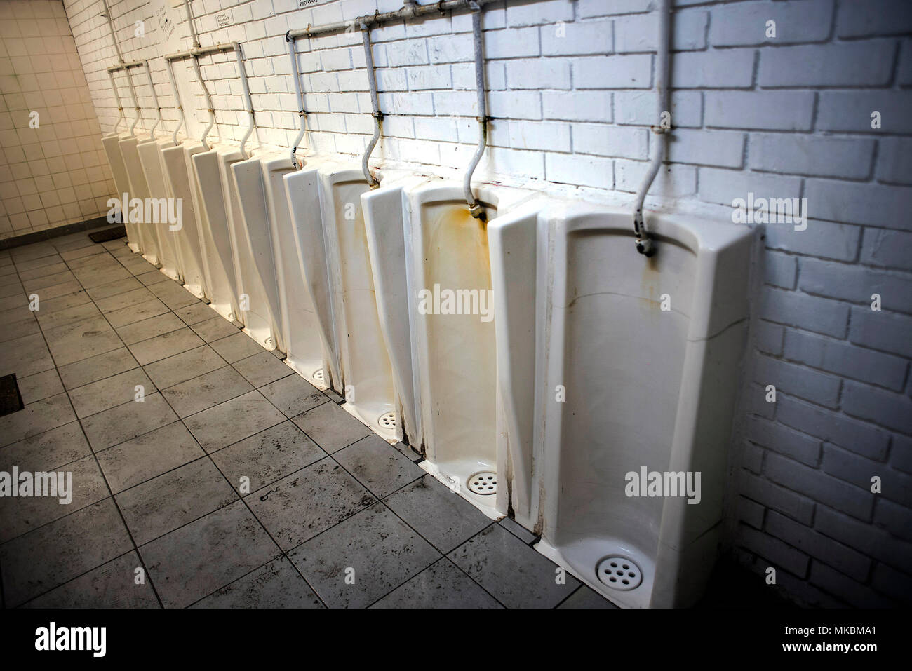 Male urinals in a public bathroom in Athens, Greece. ©Elias Verdi/Alamy