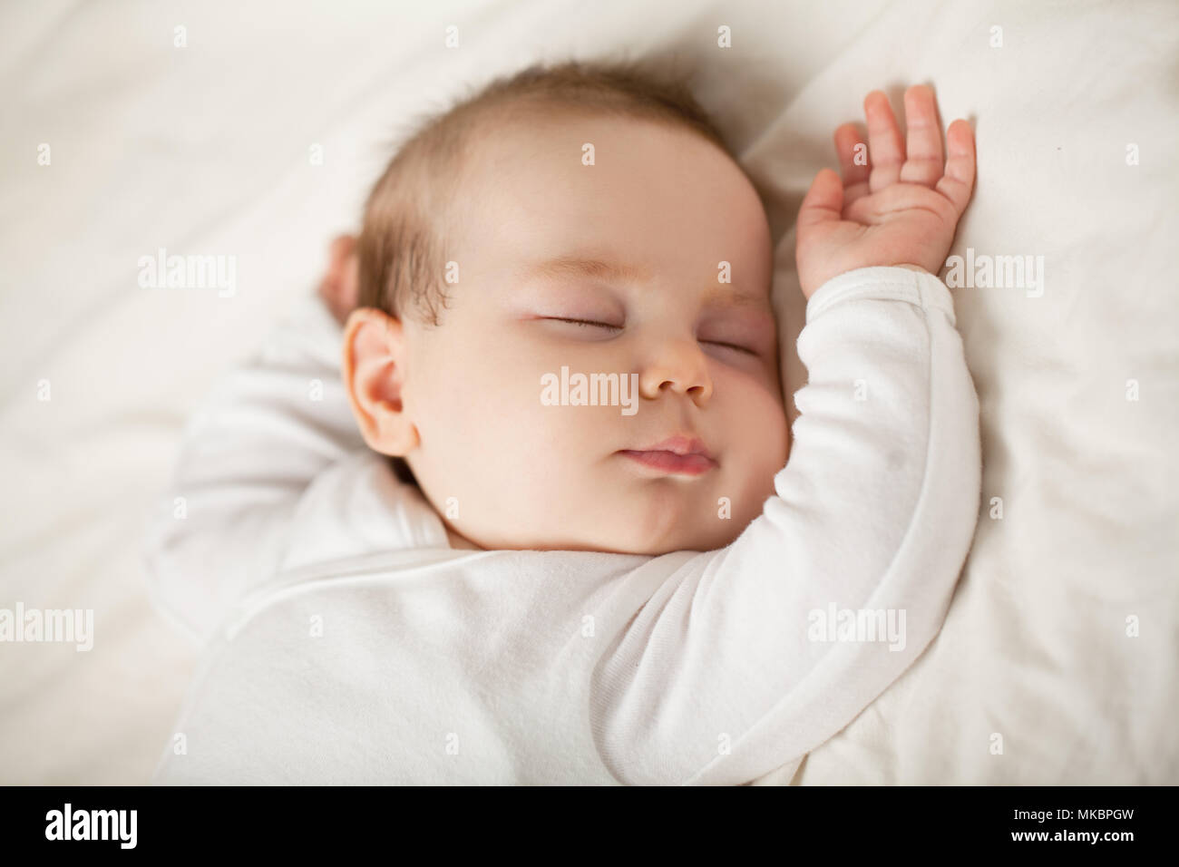 Sleeping newborn baby on white background. Small sleeping child