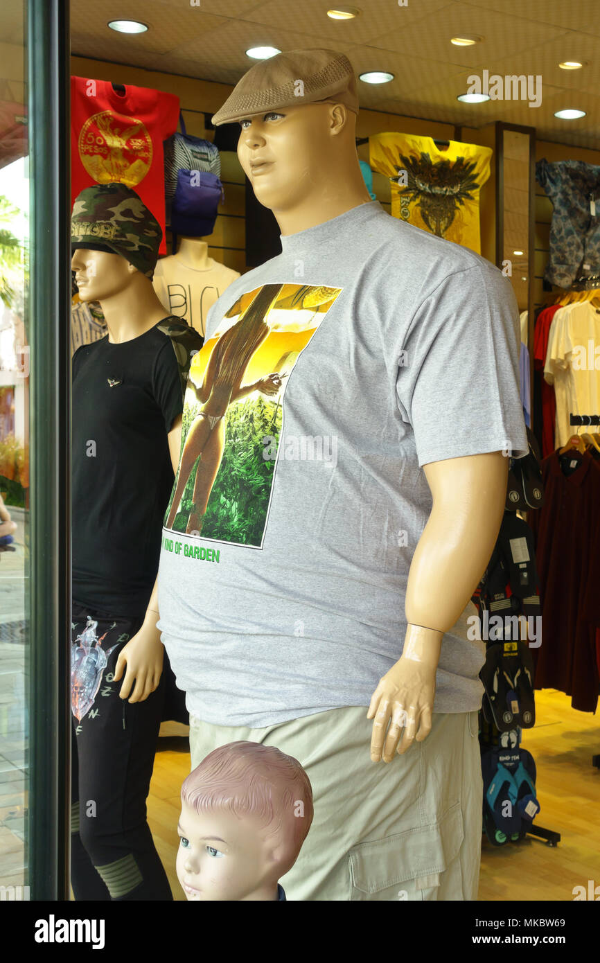 Male oversize mannequin or dummy on display in a shop window in Oranjestad, on the caribbean island of Aruba, January 2018 Stock Photo