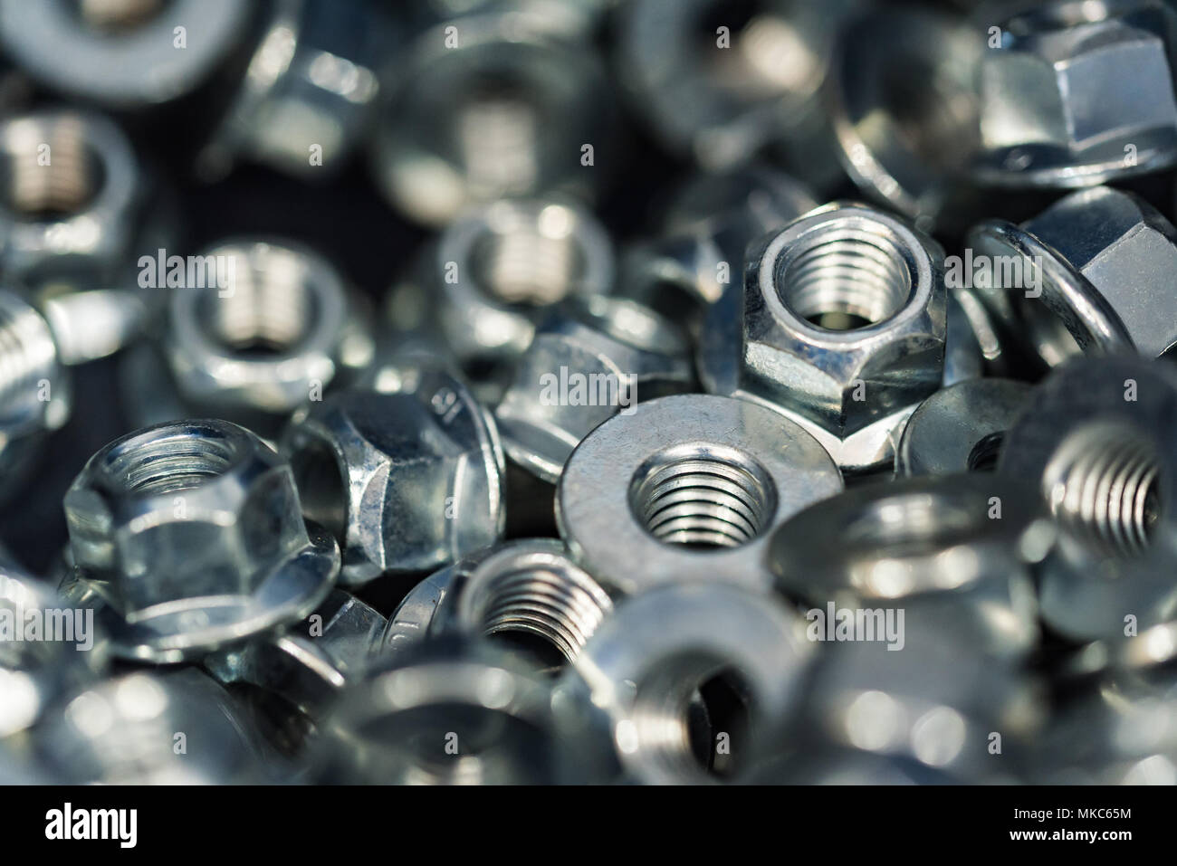Many new steel stop nuts Stock Photo Alamy