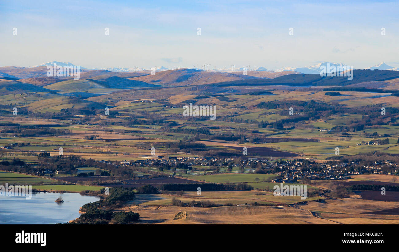 View West from the Lomond Hills towards Milnathort, Loch Leven, and distant snow-covered mountains, Fife, Scotland Stock Photo