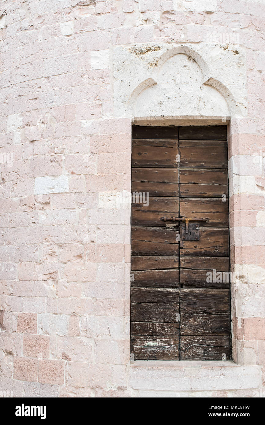 An old wooden door with an ancient stone wall Stock Photo - Alamy