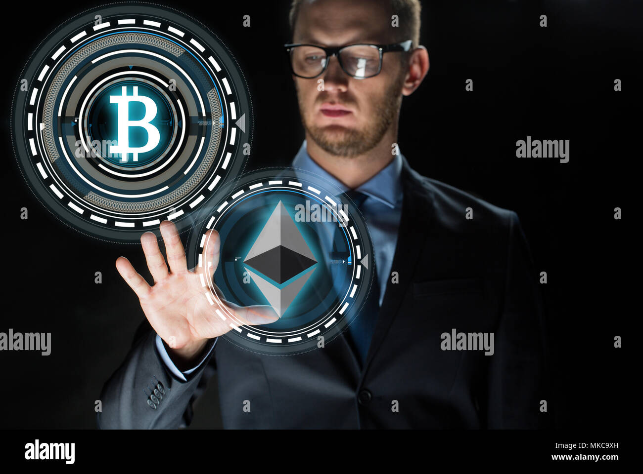 businessman with cryptocurrency holograms Stock Photo