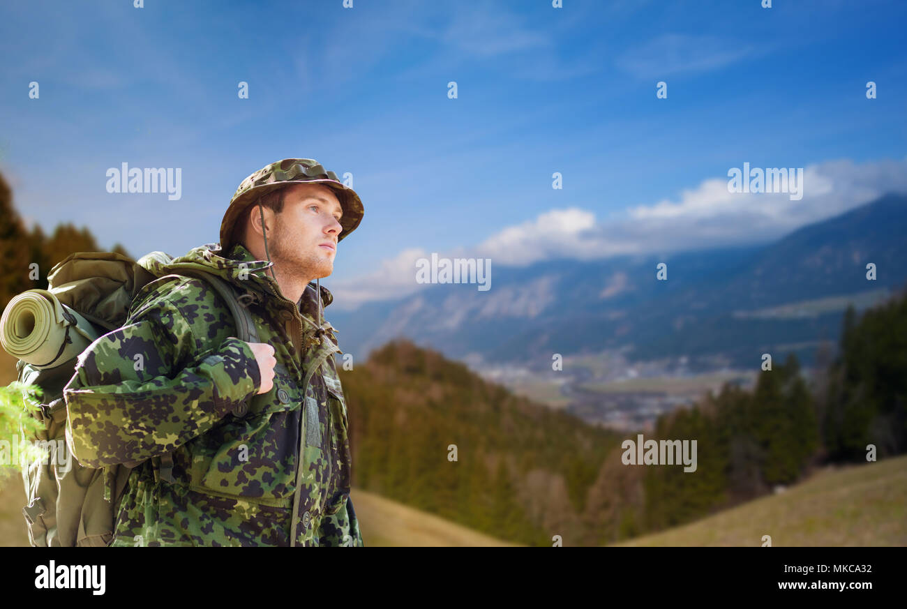 soldier in military uniform with backpack hiking Stock Photo Alamy