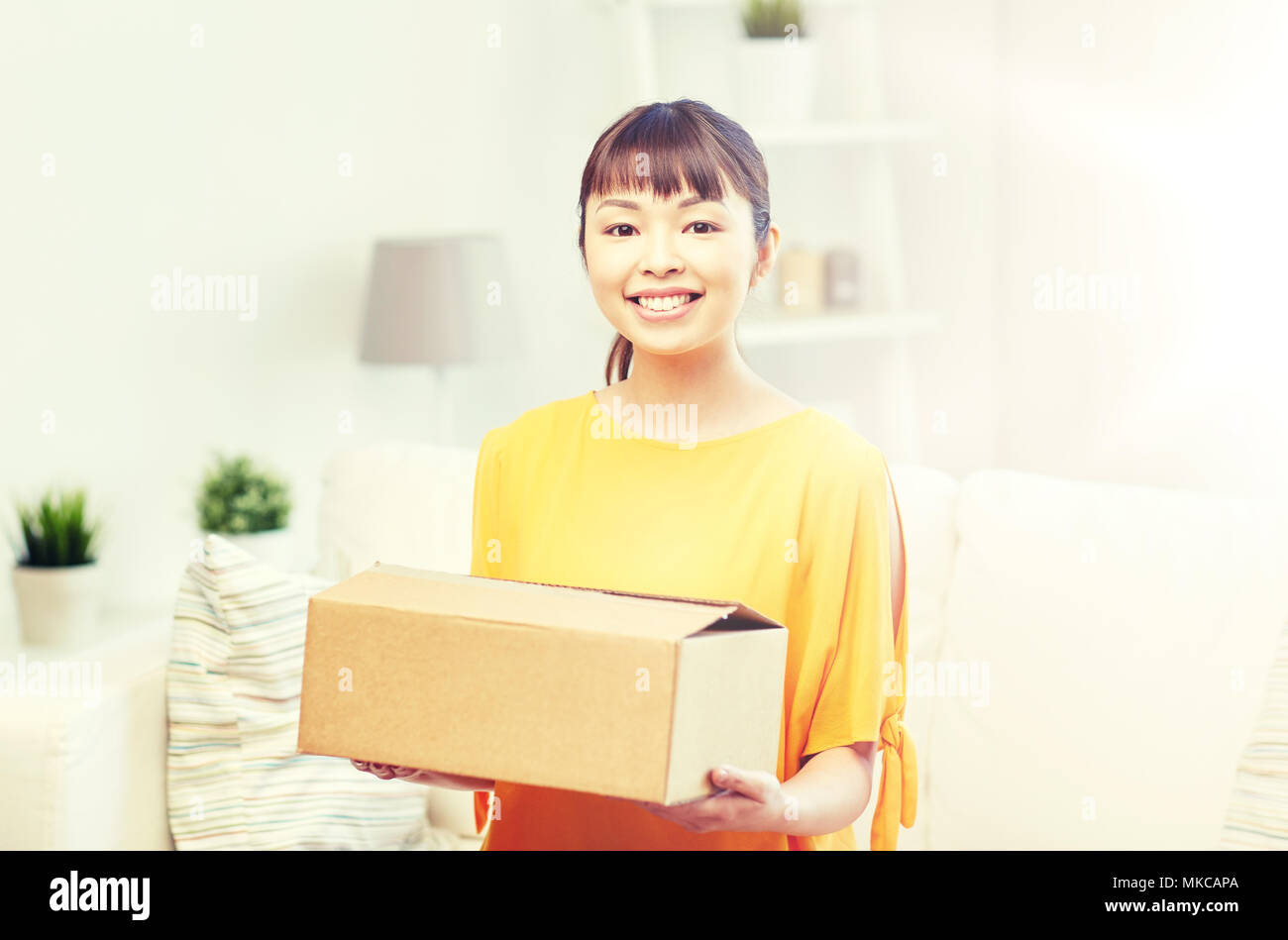 happy asian young woman with parcel box at home Stock Photo - Alamy