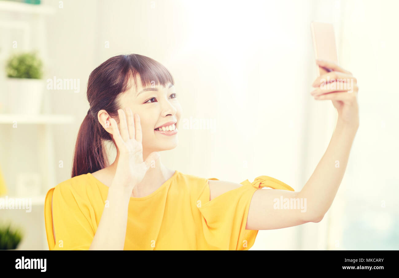 happy asian woman taking selfie with smartphone Stock Photo - Alamy