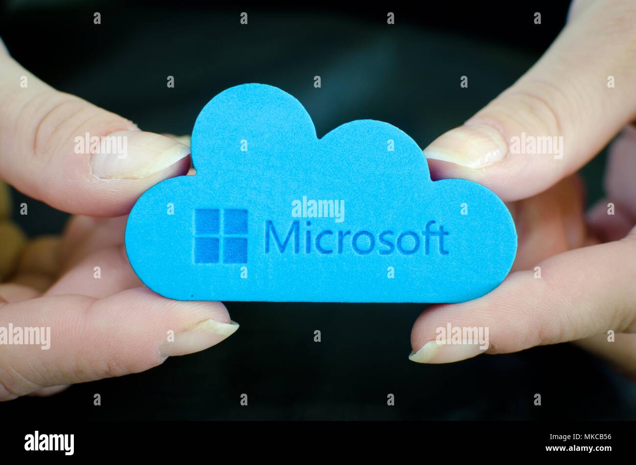 Nis, Serbia, April 24, 2018:  woman hands on black background  holding Microsoft Windows OneDrive icon Stock Photo