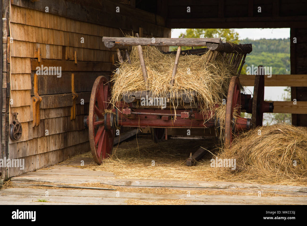 Wagon with hay in a 19th century barn on the Joslin Farm at Kings