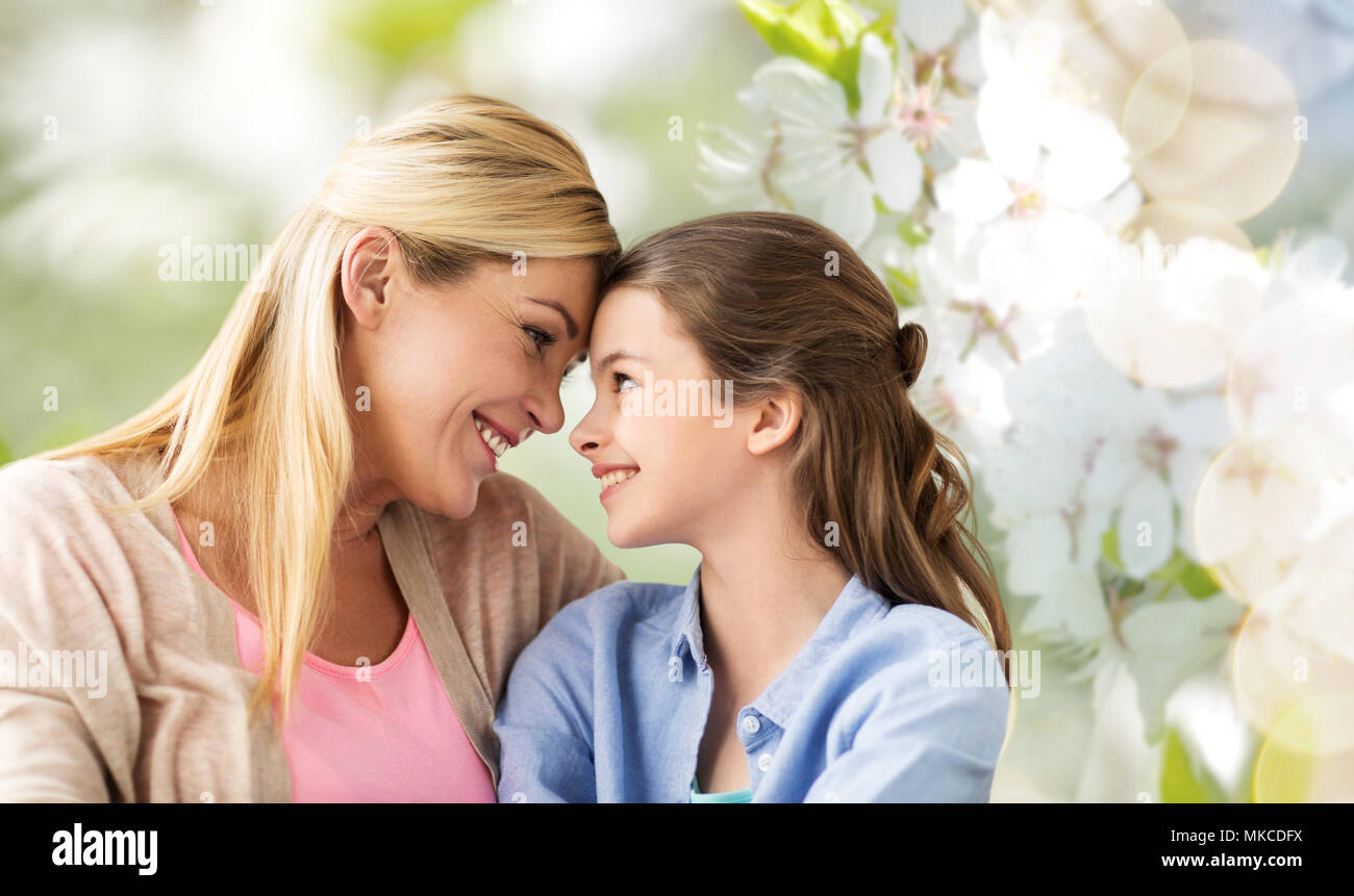 happy mother and daughter over cherry blossom Stock Photo Alamy