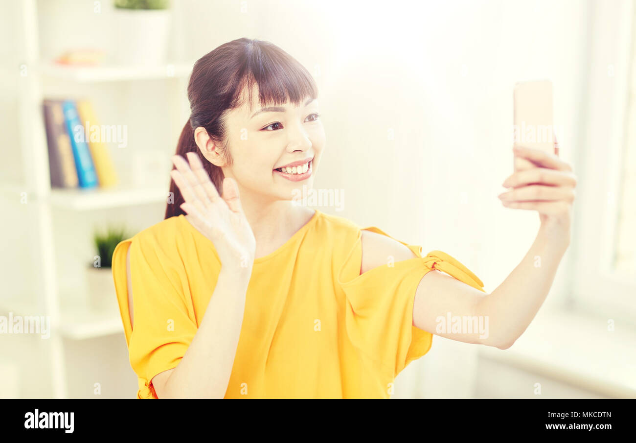 happy asian woman taking selfie with smartphone Stock Photo - Alamy