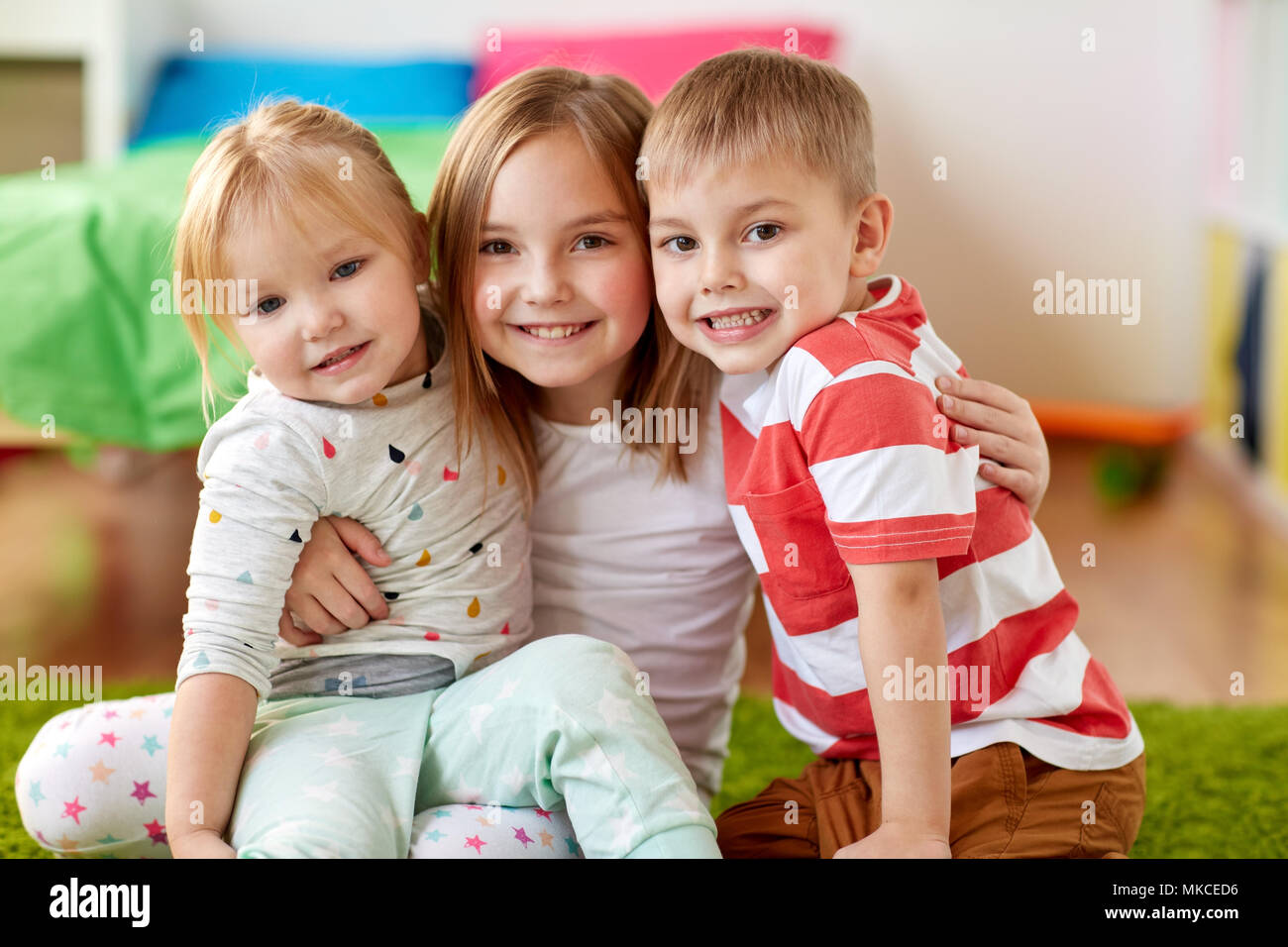 happy little kids hugging at home Stock Photo - Alamy