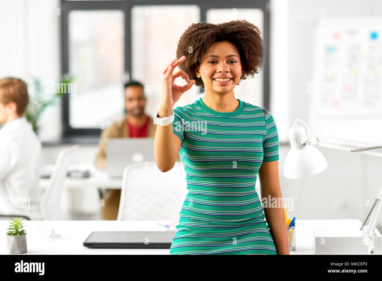 Smiling african woman hi-res stock photography and images - Alamy