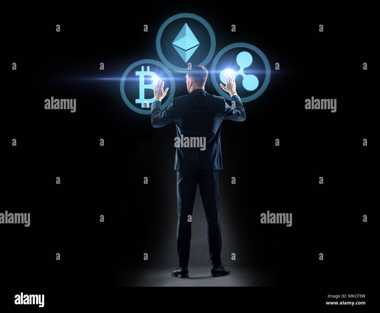 buisnessman with cryptocurrency holograms Stock Photo
