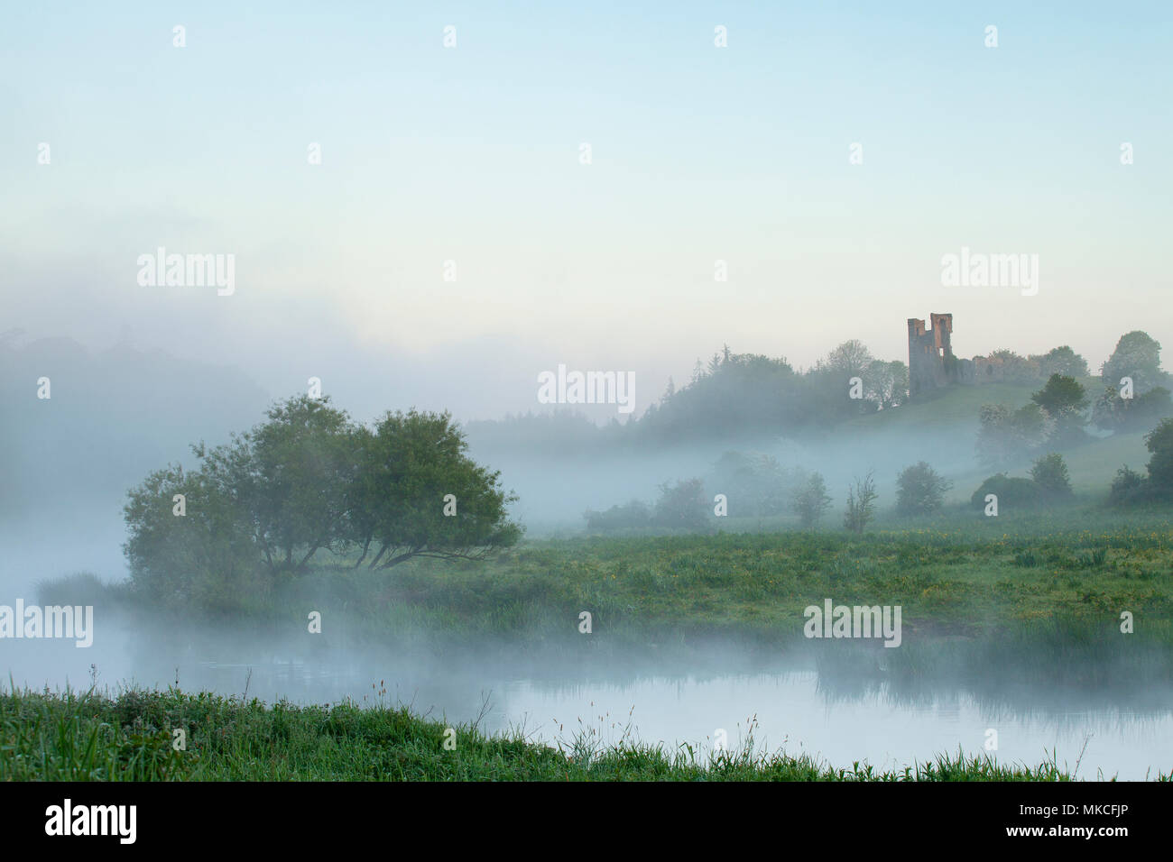 A misty morning with Dunmoe Castle on the Banks of the River Boyne near Navan Co Meath Stock Photo